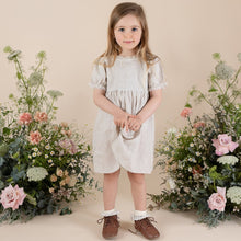 Load image into Gallery viewer, a young girl in natural colour 100% linen day dress cut above the knee with puffy short sleeve