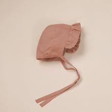 Load image into Gallery viewer, terracotta linen bonnet for baby girl on beige background