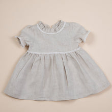 Load image into Gallery viewer, natural flax linen dress for baby girl or toddler girl on beige background.