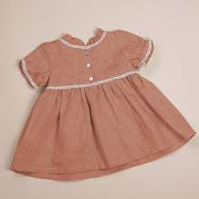 Load image into Gallery viewer, terracotta flax linen dress for baby girl or toddler girl on beige background.