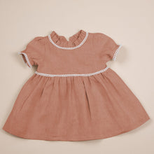 Load image into Gallery viewer, terracotta flax linen dress for baby girl or toddler girl on beige background.