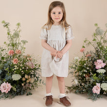 Load image into Gallery viewer, a young girl in natural colour 100% linen day dress cut above the knee with puffy short sleeve

