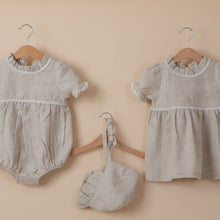 Load image into Gallery viewer, natural flax linen dress, bonnet and onesie  for baby girl or toddler girl on beige background.
