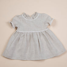 Load image into Gallery viewer, natural flax linen dress for baby girl or toddler girl on beige background.
