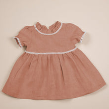 Load image into Gallery viewer, terracotta flax linen dress for baby girl or toddler girl on beige background.
